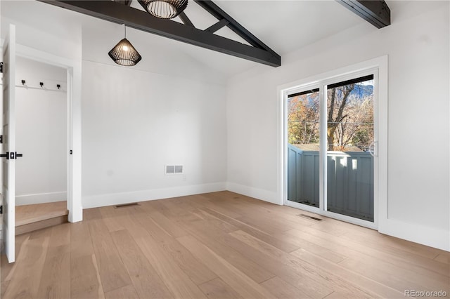 unfurnished dining area with lofted ceiling with beams and light hardwood / wood-style flooring