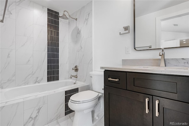 full bathroom featuring vanity, toilet, and tiled shower / bath