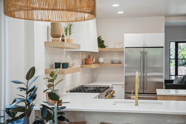 2844 Quitman St, Denver, CO 80212 - kitchen featuring high end fridge, open shelves, range, light countertops, and recessed lighting