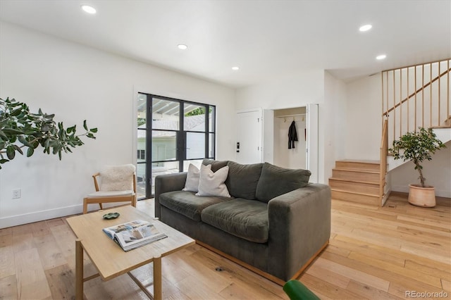 2844 Quitman St, Denver, CO 80212 - living area with stairs, light wood finished floors, recessed lighting, and baseboards