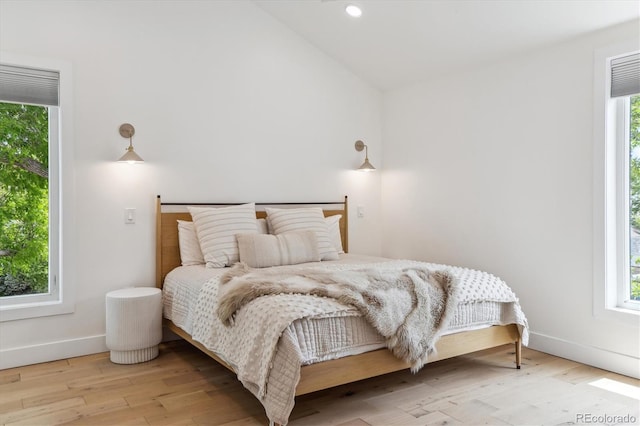 2844 Quitman St, Denver, CO 80212 - bedroom featuring wood finished floors, lofted ceiling, baseboards, and recessed lighting