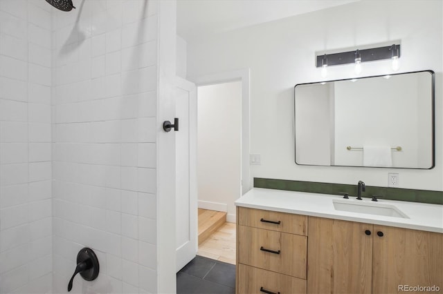 2844 Quitman St, Denver, CO 80212 - bathroom with vanity, a shower, and tile patterned floors