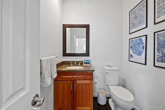 bathroom with toilet and vanity