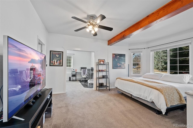 bedroom featuring ceiling fan, carpet, and beamed ceiling