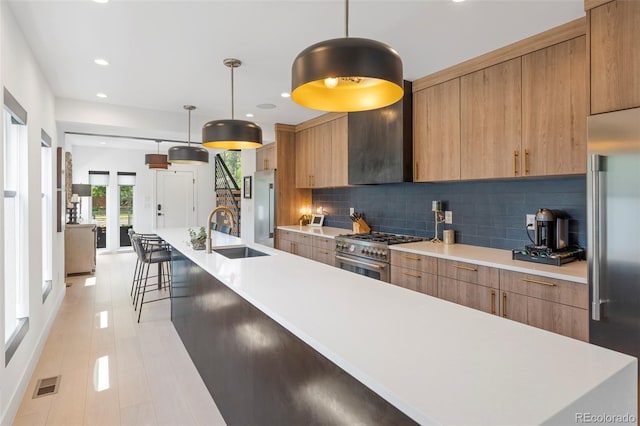 2702 Lowell Blvd, Denver, CO 80211 - kitchen with high quality appliances, modern cabinets, light countertops, a sink, and recessed lighting