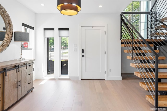 2702 Lowell Blvd, Denver, CO 80211 - entrance foyer featuring stairs, light wood-style floors, baseboards, and recessed lighting