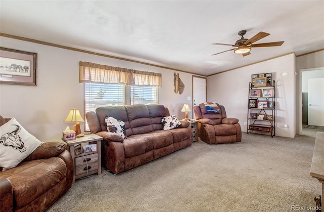 living room featuring lofted ceiling, crown molding, carpet floors, and ceiling fan