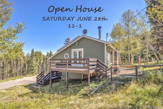 32252 Steven Way, Conifer, CO 80433 - rear view of property with a wooden deck