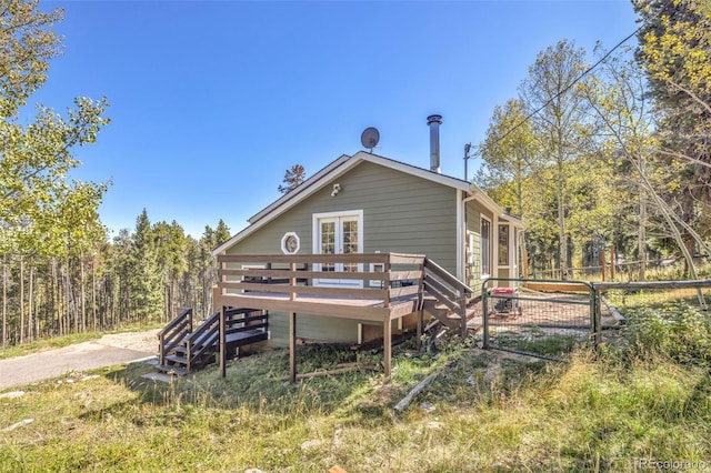 32252 Steven Way, Conifer, CO 80433 - back of property with a deck and french doors