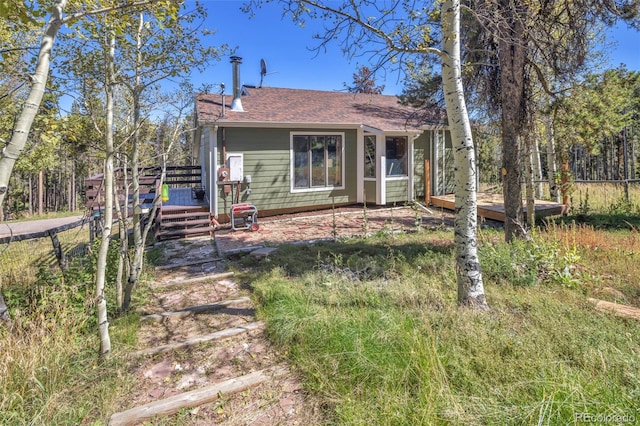 32252 Steven Way, Conifer, CO 80433 - bungalow featuring a wooden deck and a shingled roof