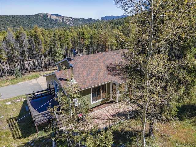 32252 Steven Way, Conifer, CO 80433 - back of property with a view of trees, a mountain view, and a shingled roof