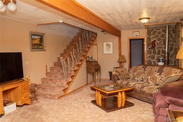 carpeted living area featuring stairway