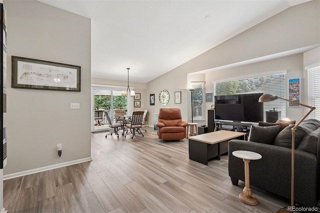 9747 W Peakview Dr, Littleton, CO 80123 - living area with light wood finished floors and high vaulted ceiling