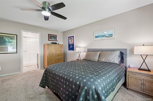 9747 W Peakview Dr, Littleton, CO 80123 - bedroom with light colored carpet, ensuite bathroom, and ceiling fan