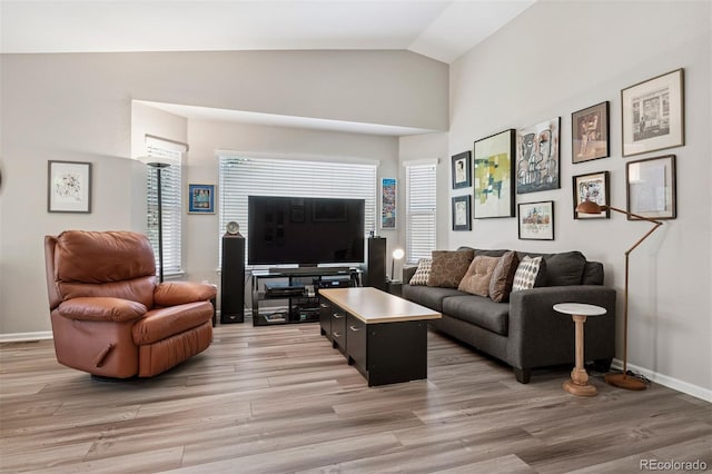 9747 W Peakview Dr, Littleton, CO 80123 - living room featuring light wood-style floors and vaulted ceiling