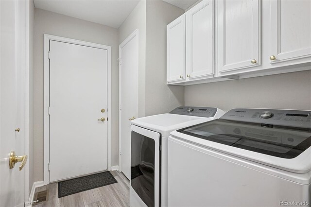 9747 W Peakview Dr, Littleton, CO 80123 - laundry room with independent washer and dryer, cabinet space, and wood finished floors