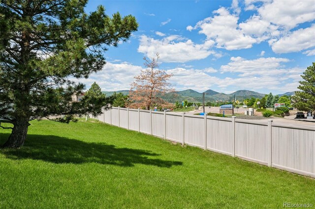 9747 W Peakview Dr, Littleton, CO 80123 - view of yard with a mountain view