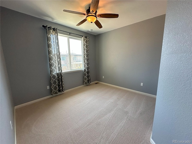 9482 Kendrick Way, Arvada, CO 80007 - unfurnished room with ceiling fan, light carpet, and baseboards