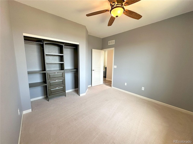 9482 Kendrick Way, Arvada, CO 80007 - unfurnished bedroom with light colored carpet, a closet, baseboards, and ceiling fan