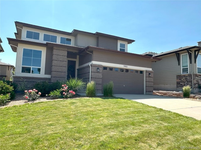 9482 Kendrick Way, Arvada, CO 80007 - view of front of property featuring brick siding, concrete driveway, a front lawn, and an attached garage