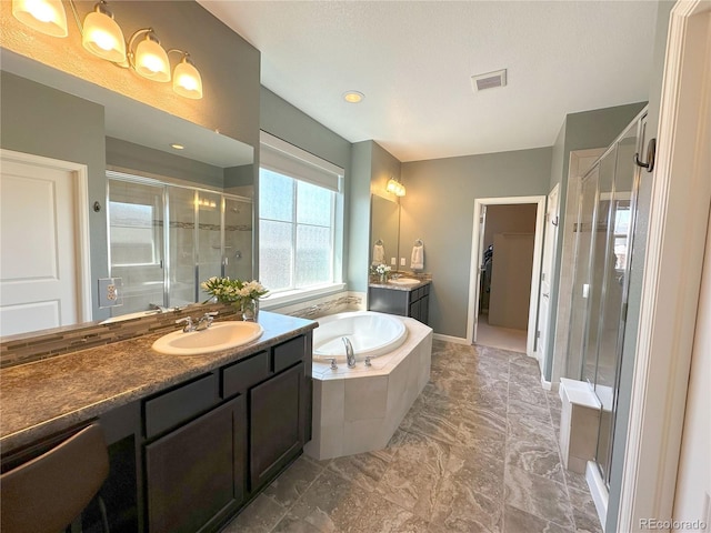 9482 Kendrick Way, Arvada, CO 80007 - full bath with a shower stall, two vanities, a bath, and marble finish flooring