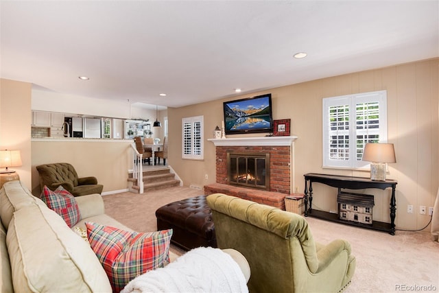 6624 S Sycamore St, Littleton, CO 80120 - living room featuring carpet flooring, a brick fireplace, and recessed lighting