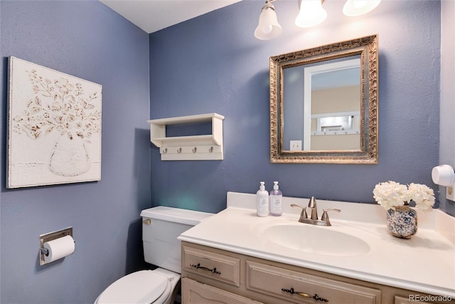 6624 S Sycamore St, Littleton, CO 80120 - bathroom with toilet and vanity