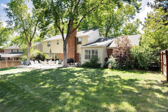 6624 S Sycamore St, Littleton, CO 80120 - rear view of house featuring a patio area and a chimney