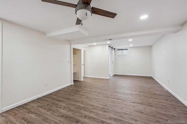 interior space featuring recessed lighting, baseboards, and wood finished floors