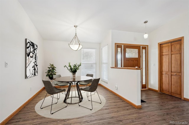 dining room with wood finished floors and baseboards