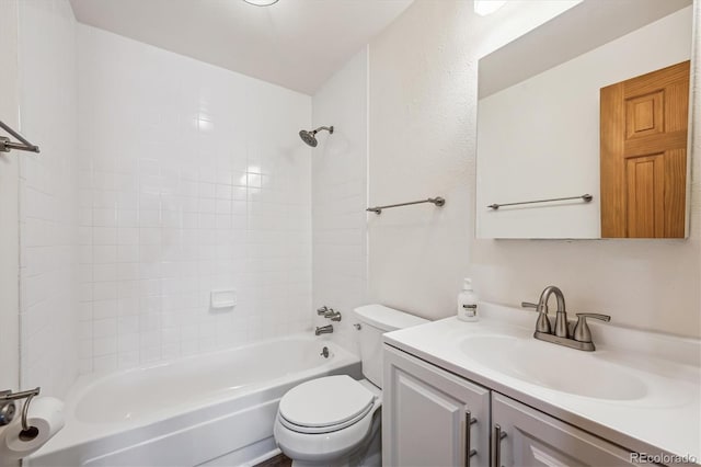 bathroom with toilet, vanity, and shower / bathtub combination