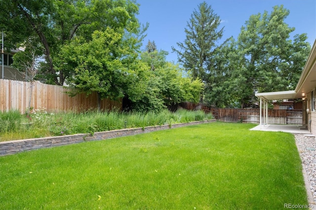 1843 S Pierson Ct, Lakewood, CO 80232 - fenced backyard with a patio area