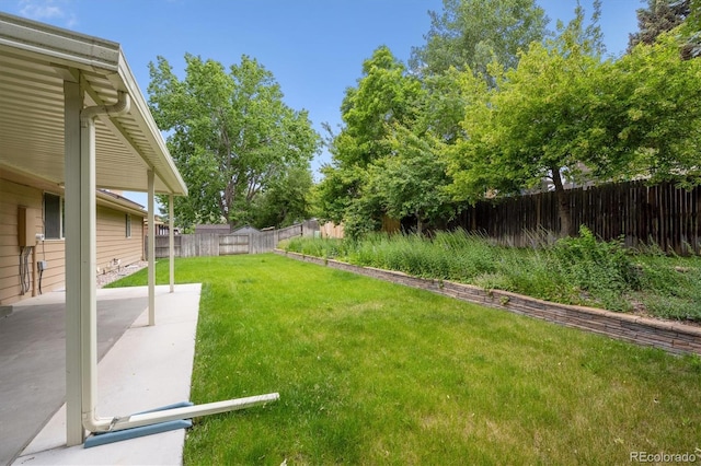 1843 S Pierson Ct, Lakewood, CO 80232 - fenced backyard with a patio area