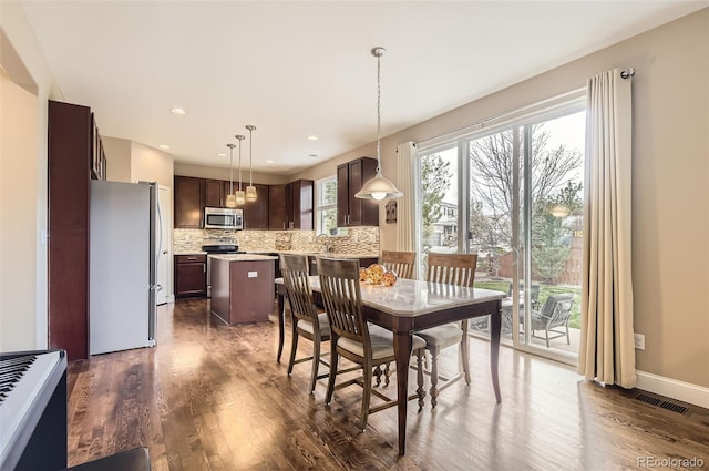dining area featuring recessed lighting, baseboards, dark wood finished floors, and visible vents