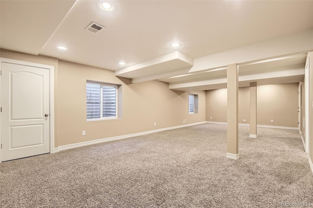 basement with baseboards, carpet flooring, recessed lighting, and visible vents