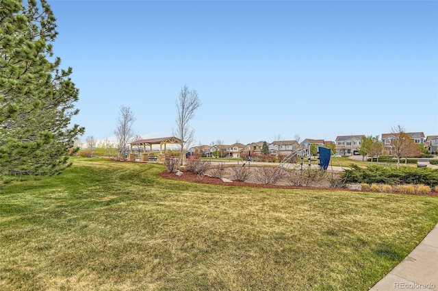 view of yard with a gazebo and a residential view
