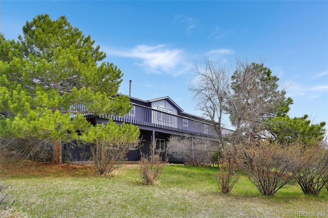exterior space with a yard and a deck