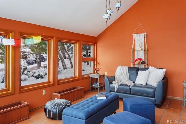 tiled living room with high vaulted ceiling