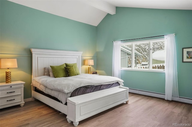 bedroom with lofted ceiling with beams, light hardwood / wood-style flooring, and baseboard heating