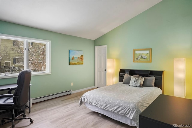 bedroom with lofted ceiling, light wood-type flooring, and a baseboard radiator