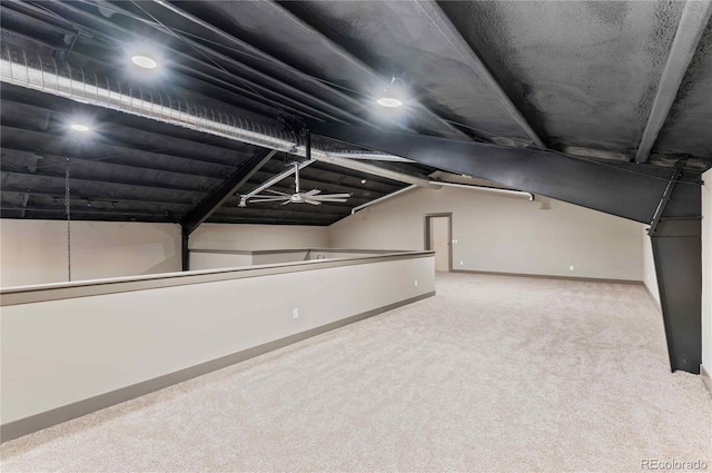 bonus room featuring ceiling fan, carpet floors, and vaulted ceiling