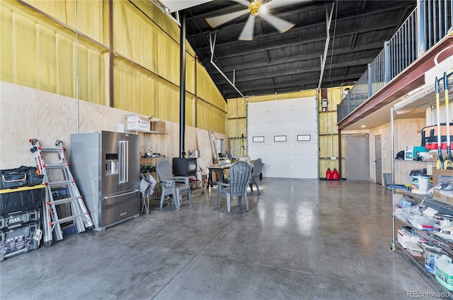 garage featuring high quality fridge and ceiling fan