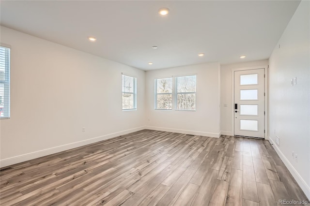 6874 Zuni Ct, Denver, CO 80221 - foyer featuring wood finished floors, baseboards, and recessed lighting