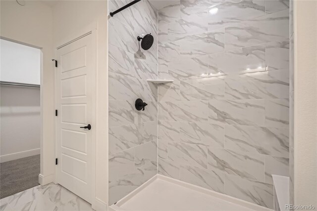 6874 Zuni Ct, Denver, CO 80221 - full bathroom with tiled shower, marble look tile flooring, and baseboards