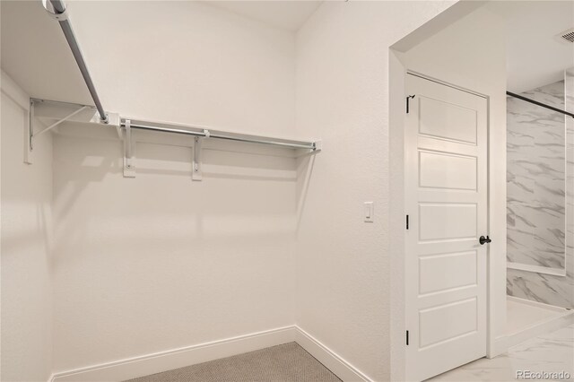 6874 Zuni Ct, Denver, CO 80221 - spacious closet with light marble finish flooring