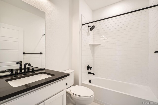 6874 Zuni Ct, Denver, CO 80221 - bathroom with toilet, vanity, and tub / shower combination