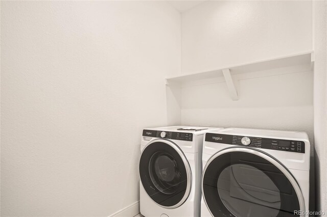 6874 Zuni Ct, Denver, CO 80221 - laundry area featuring separate washer and dryer and baseboards