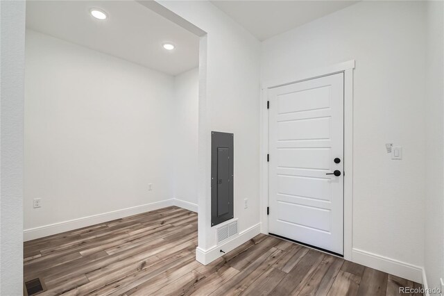 6874 Zuni Ct, Denver, CO 80221 - foyer entrance with wood finished floors, electric panel, baseboards, and recessed lighting