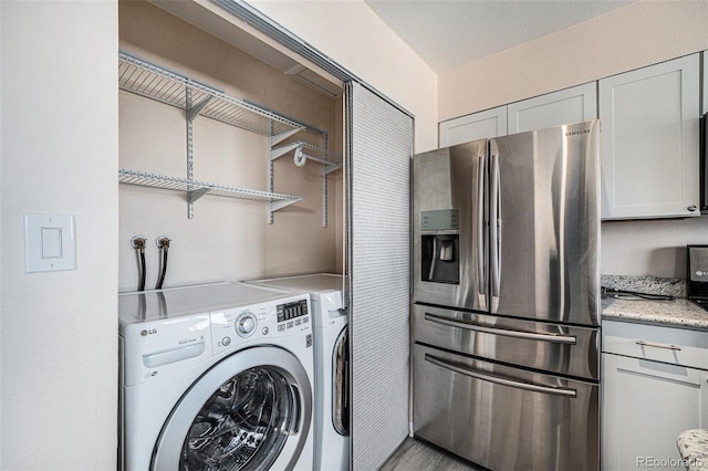 washroom with washer and clothes dryer