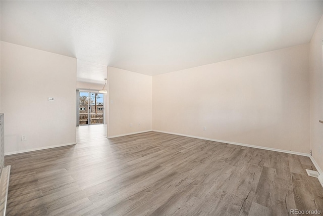 unfurnished room featuring light hardwood / wood-style flooring